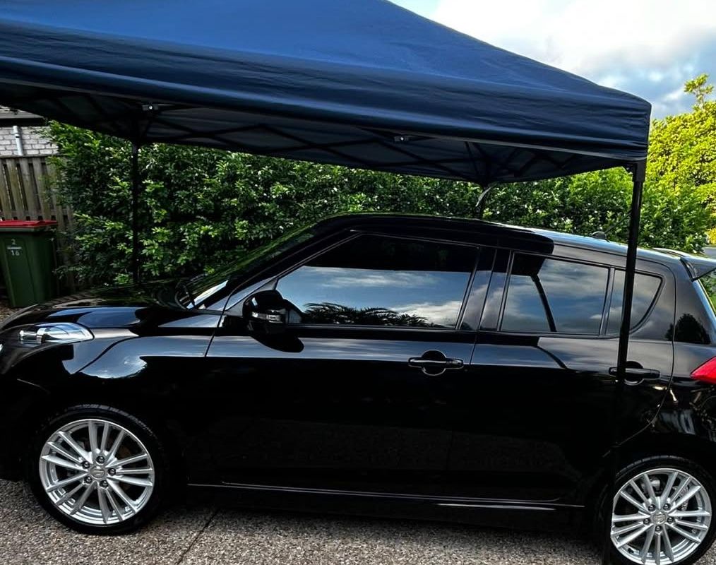 A Suzuki Swift Sport's paintwork with a deep, swirl-free gloss after a J-Bros ceramic coating at Burleigh Waters