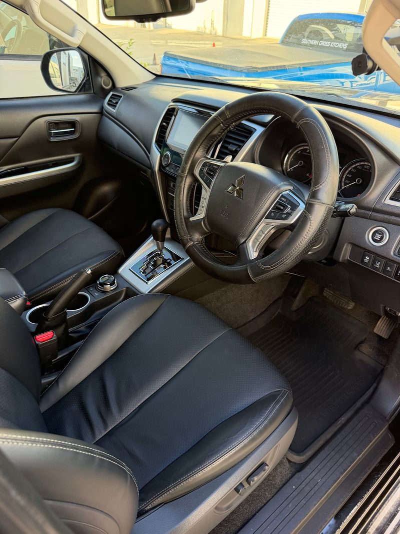 The same Mitsubishi Triton cabin after a J-Bros Interior Deep Clean, with clean seats, mats and footwell