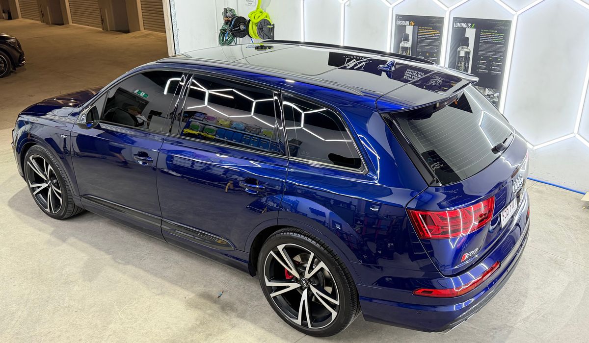 A dark blue Audi SQ7 with a deep, showroom-ready gloss finish at the J-Bros Burleigh Waters workshop